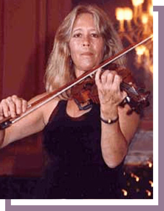 A woman playing the violin in front of a fireplace.